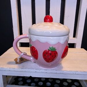A Lang Strawberry Pink Ceramic Mug with Lid.